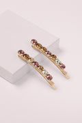 Glow On & Sparkle Gemstone Bobby Pins on a pink box 