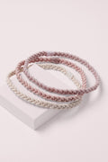Salutation Slim Braided Headbands on a pink box 