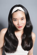 model wearing Lotus Soft Pleated Headband on her head 