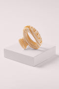ellipse oval hair claw clip in caramel marble on white box